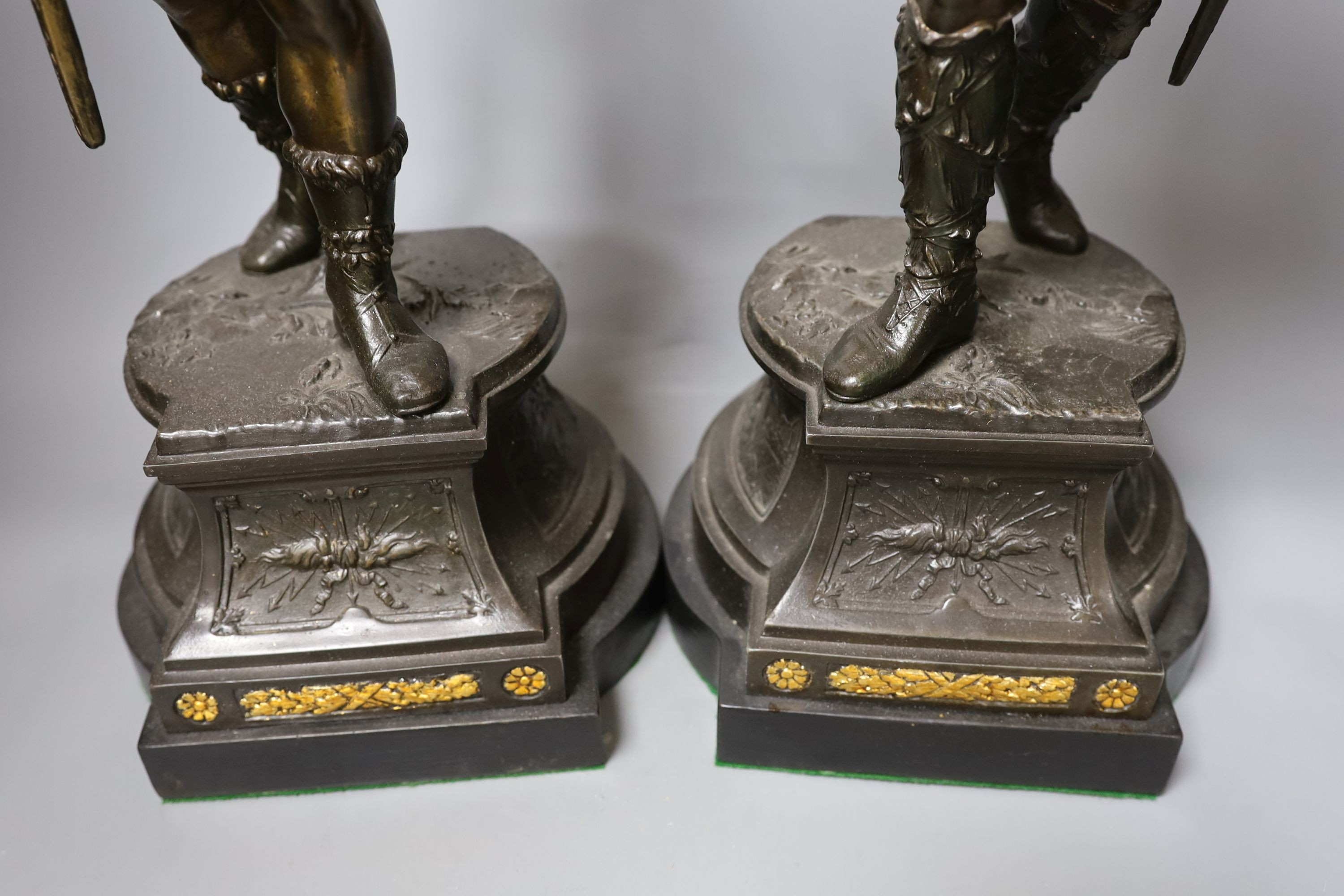 A pair of bronzed spelter gladiator figures - 55cm tall